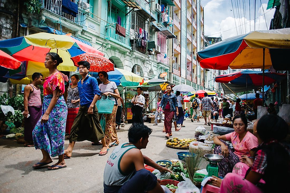 People walk the streets of Yangon, Myanmar. Editorial credit: Alvaro Candia / Shutterstock.com. 
