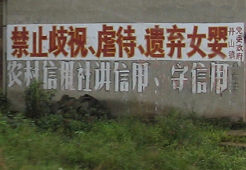 Painted on the side of this building in Sichuan, China is a message proclaiming the unlawfulness of discriminating against, mistreating, or abandoning female infants.