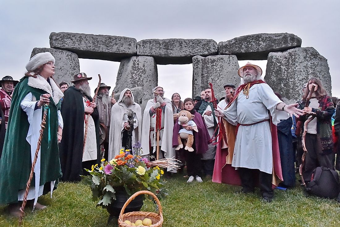 Pagans and druids celebrate the equinox at Stonehenge. Editorial credit: 1000 Words / Shutterstock.com