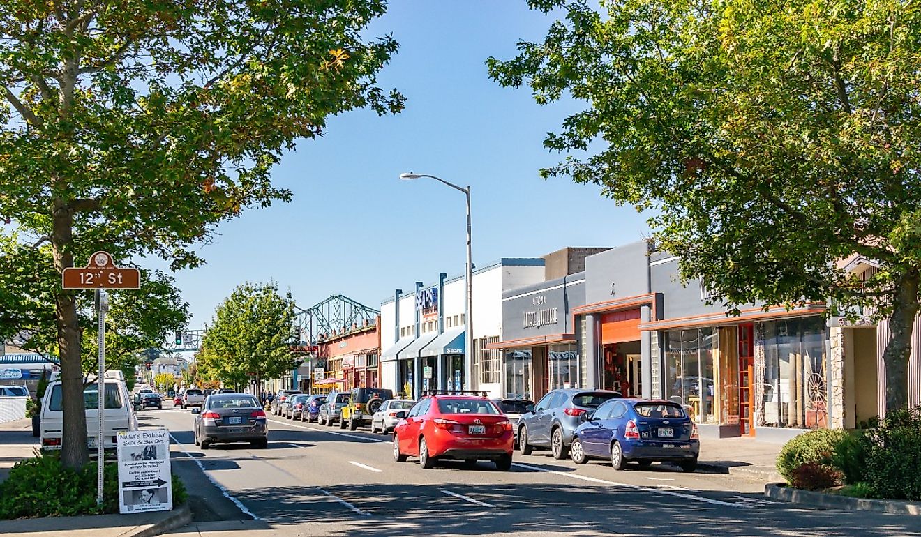 Cars on the street in downtown Astoria with Astoria-Megler Bridge. Image credit Enrico Powell via Shutterstock