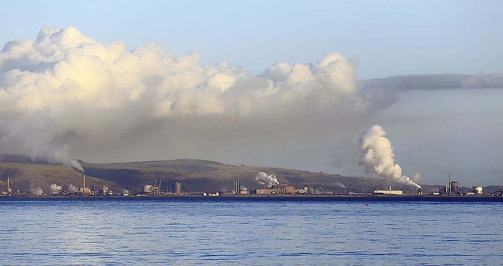 Plumes of smoke rise from coal-fired steel mills in Port Talbot, Wales, United Kingdom.