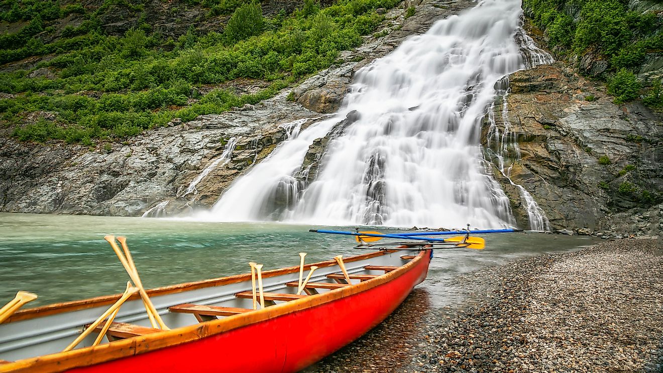 Nugget Falls Mendenhall Glacier Juneau Alaska, is a fan waterfall. Image credit: aarbois/Shutterstock.com