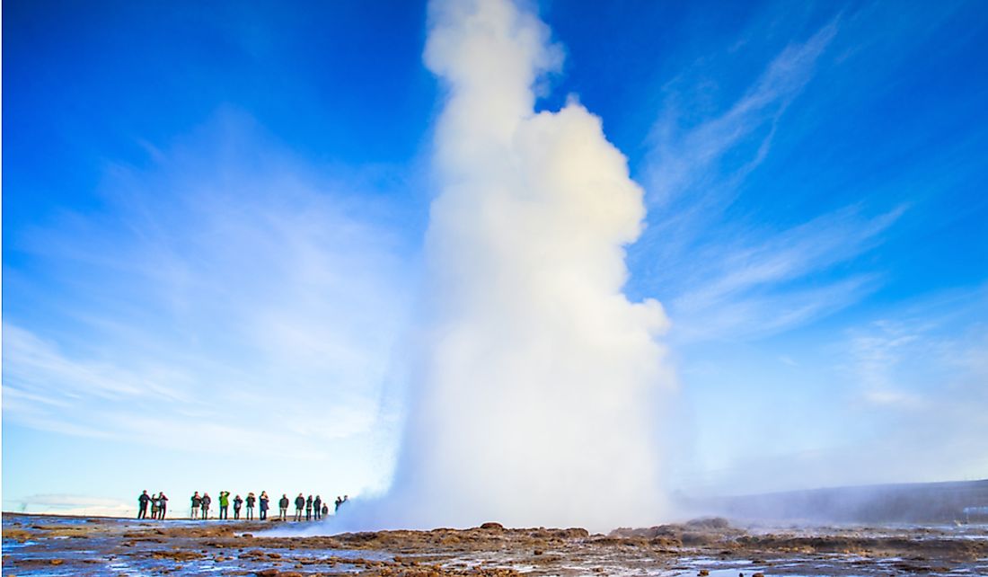 Tourists visit the Strokkur geysers in Iceland.