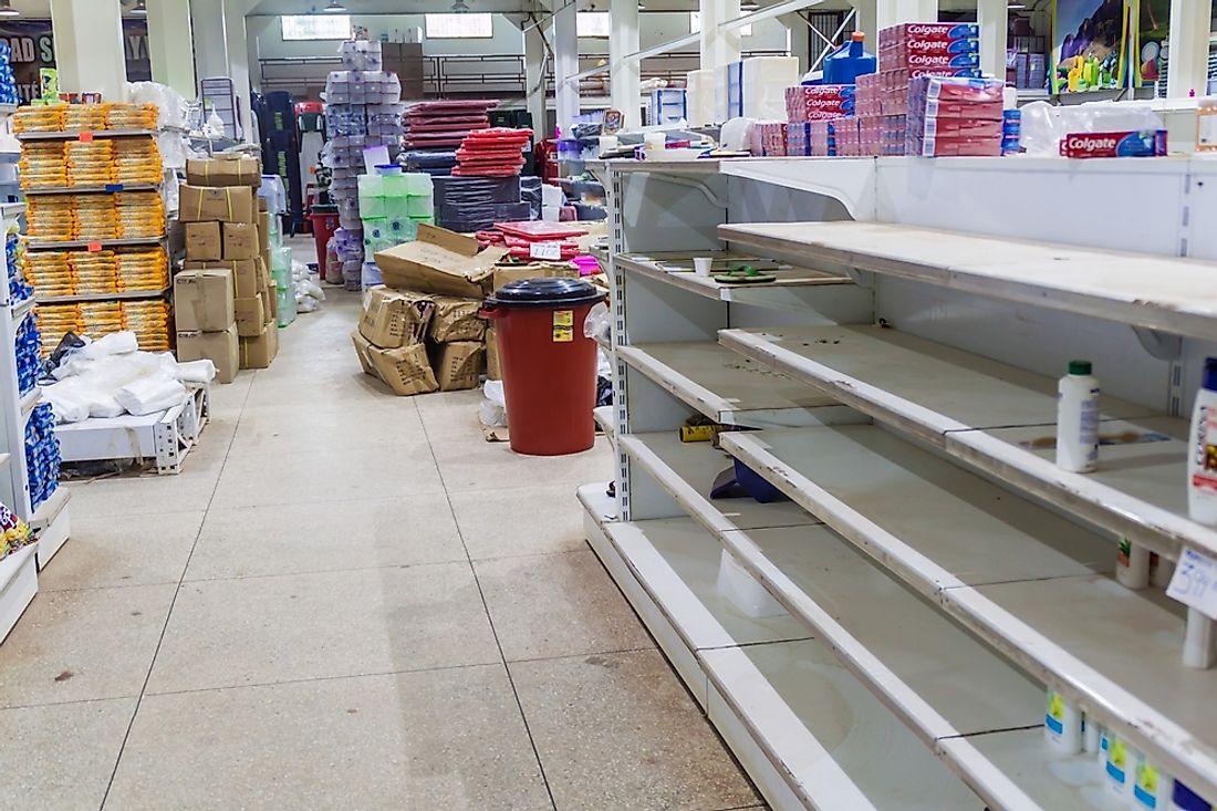 An empty supermarket in Venezuela. Editorial credit: Matyas Rehak / Shutterstock.com. 