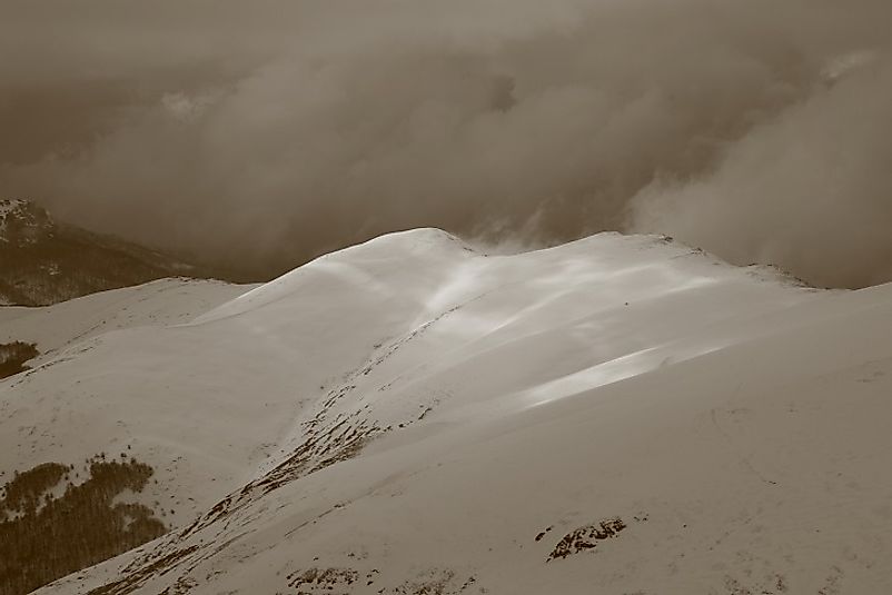 Snow and clouds upon the peak of Midzor in Serbia.