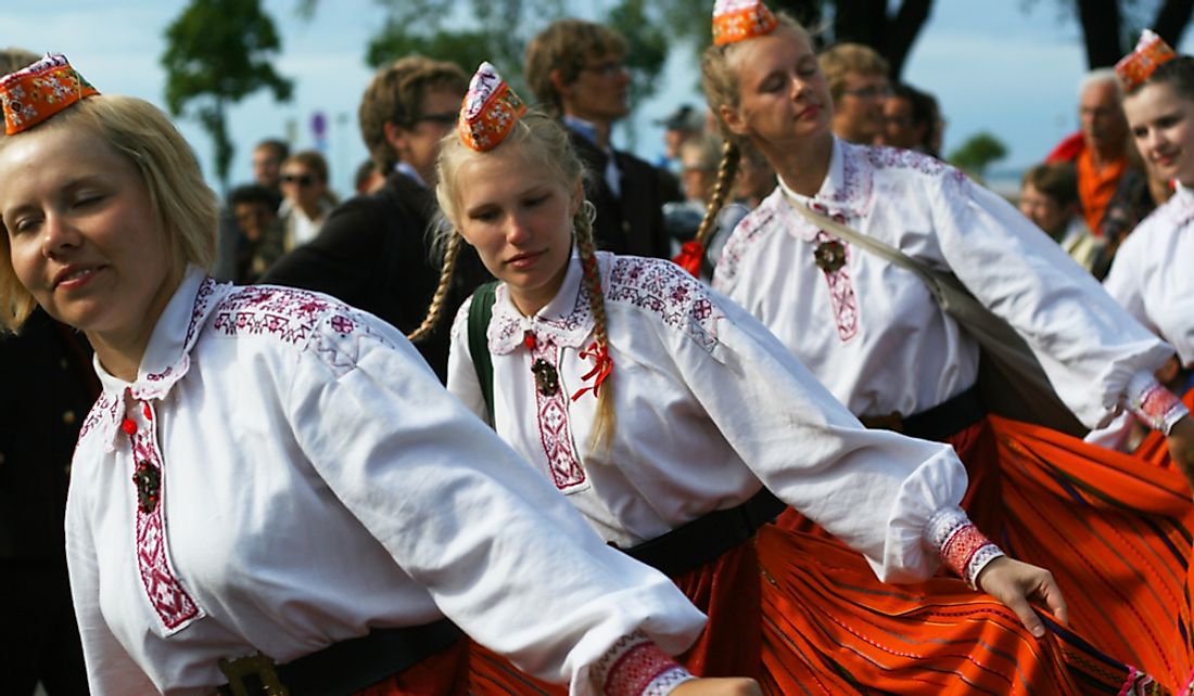 Young women dancing at a traditional Estonian folk music festival.  Editorial credit: Jaagurak / Shutterstock.com