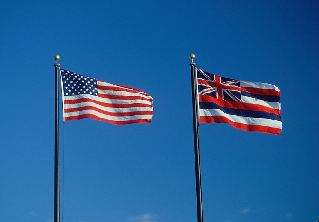 The state flag of Hawaii next to the flag of the United States. 
