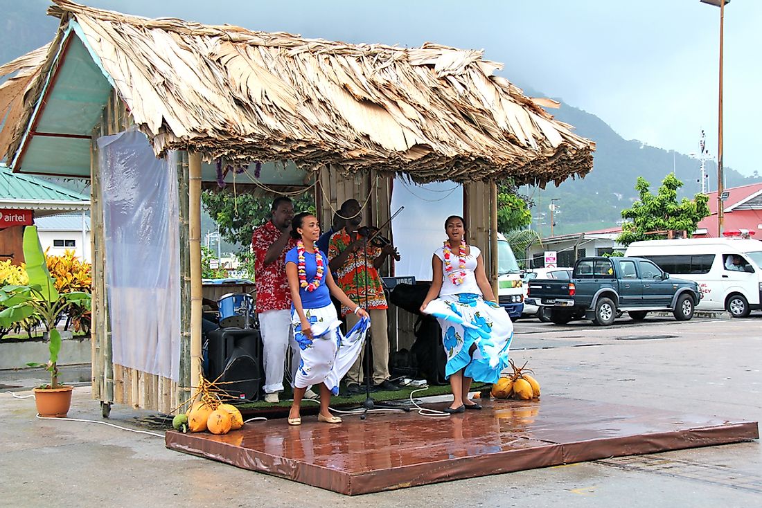 Dancers and musicians from Seychelles welcome cruise ship passengers. Editorial credit: bumihills / Shutterstock.com.