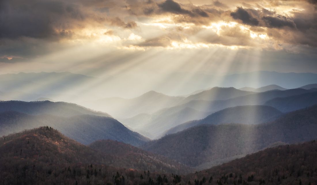 Crepuscular rays light up portions of the Blue Ridge Mountains in North Carolina.