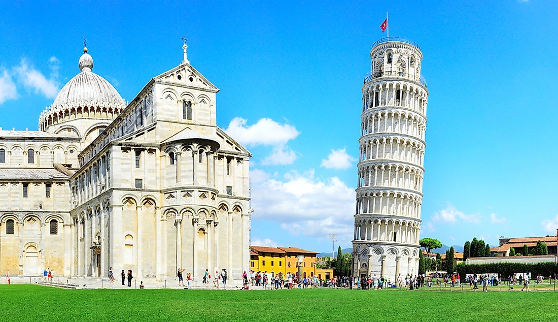The Learning Tower of Pisa (right) beside the Pisa Cathedral. 