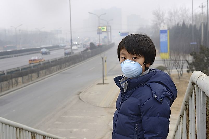 A young man in Beijing wears a mask to protect his respiratory tract from smog in one of the world's worst urban areas in terms of air quality.