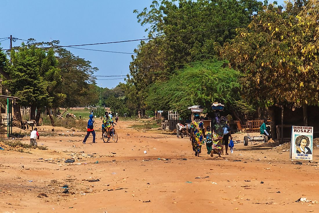 Women and men walking in Ouagadougou, Burkina Faso. Editorial credit: MattLphotography / Shutterstock.com.