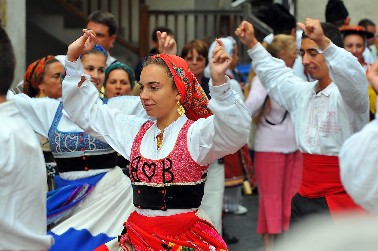Portuguese people in their traditional costume dancing and celebrating life. Image credit: mountainpix/Shutterstock.com