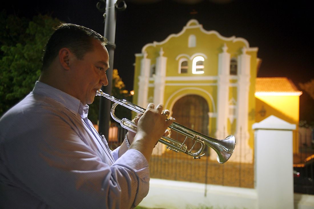 A Venezuelan musician plays in front of a church. Editorial credit: amnat30 / Shutterstock.com. 