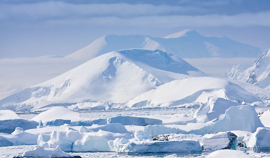 The higher elevation of the South Pole contributes to its cold temperatures.