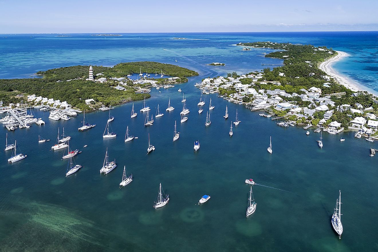 Aerial view of the harbour and lighthouse in Hope Town on Elbow Cay off the island of Abaco, Bahamas. Image credit: pics721/Shutterstock.com