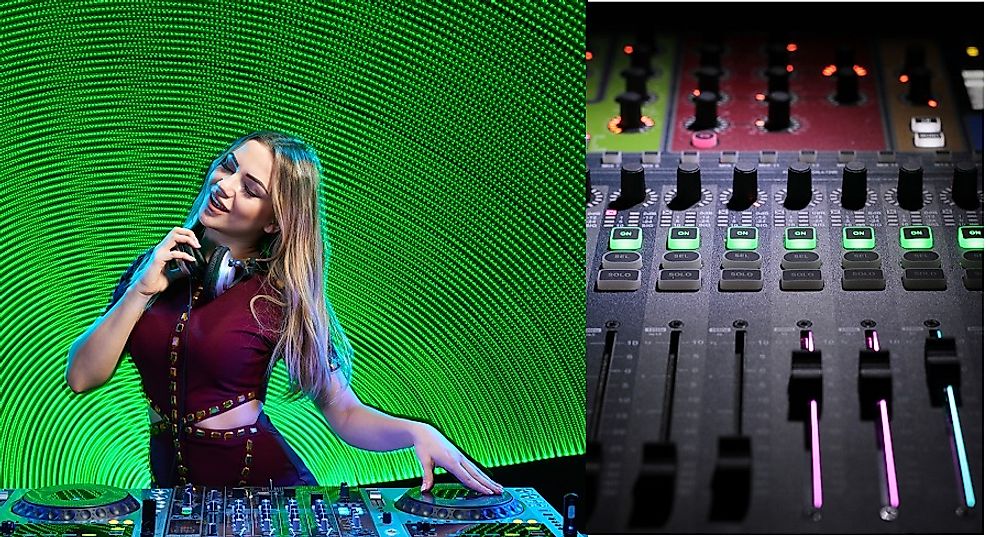 A disc jockey (DJ) using a mixer board to enhance the experience of dancing club-goers.