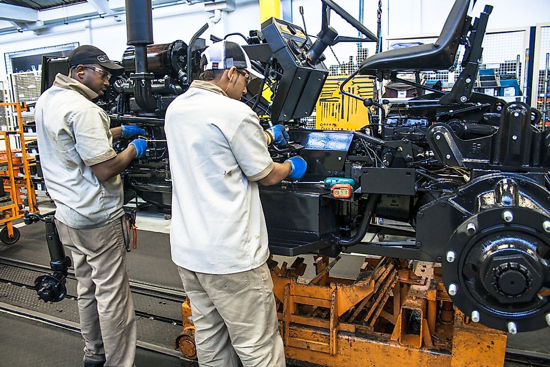 Workers tend to a vehicle assembly line in Sao Paulo, Brazil. The automobile industry is a major component of Brazil's economy. Photo credit: Alf Ribeiro / Shutterstock.com.