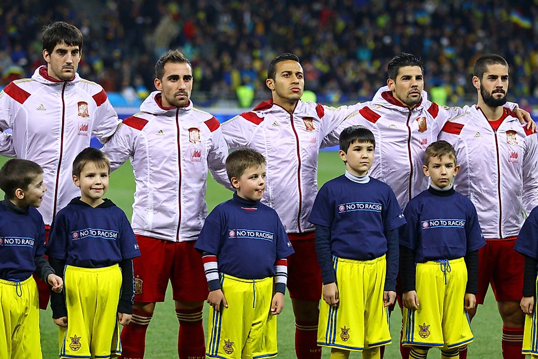 The Spanish national football team stands for the Spanish national anthem. Editorial credit: katatonia82 / Shutterstock.com