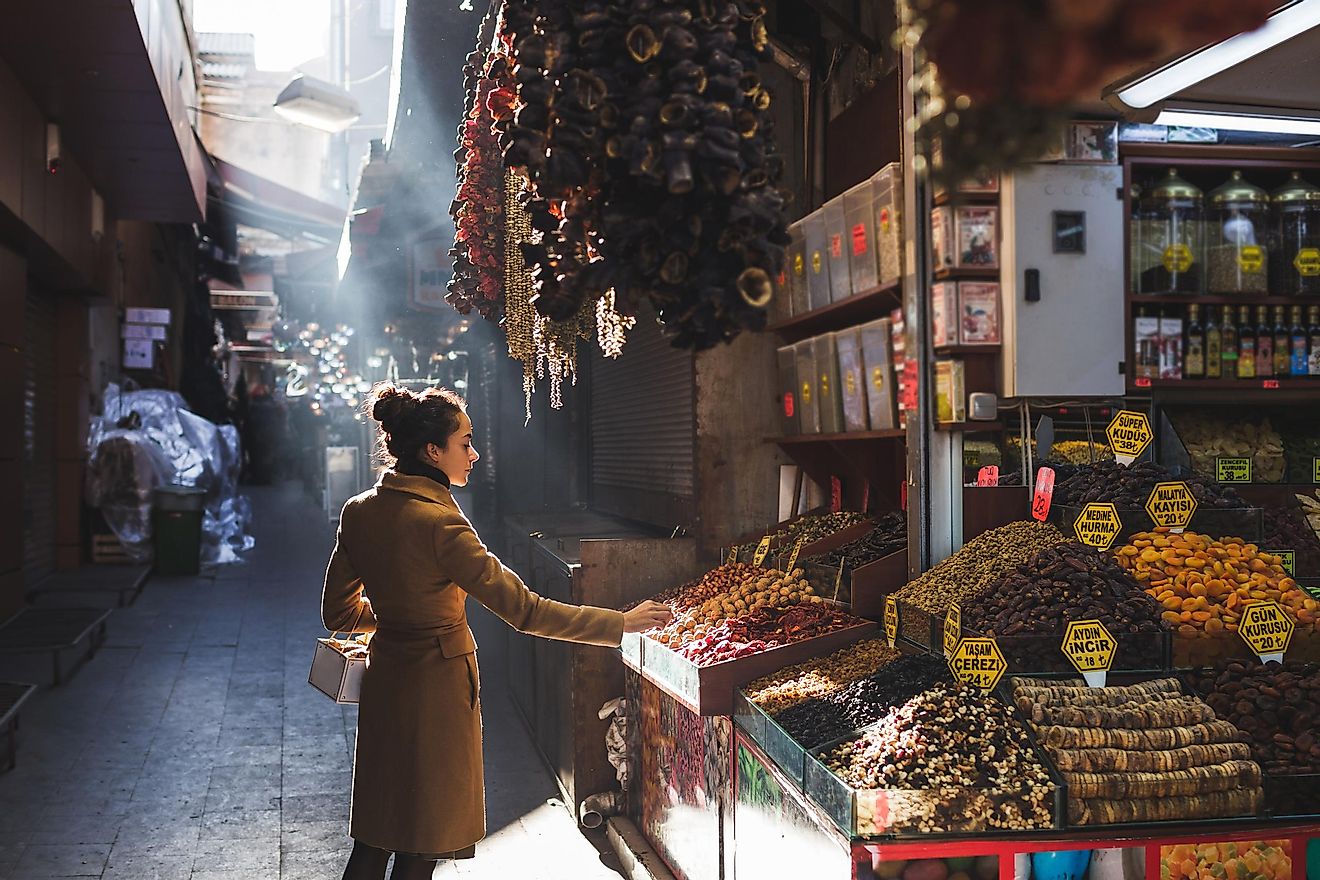 A person picks out dried good in the Grand Bazaar Market in Istanbul, Turkey. Image credit:  Breslavtsev Oleg/Shutterstock