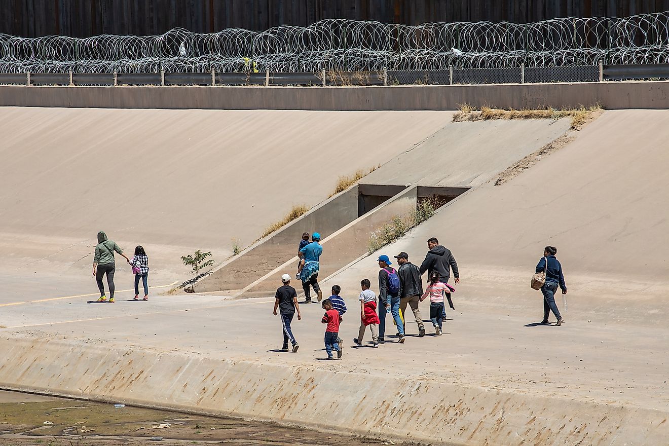 Migrants from Central America cross the US-Mexico border to seek asylum in the United States. Image credit:  Mike Hardiman/Shutterstock.com