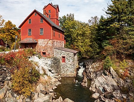 Old Red Mill by the creek in Jericho, Vermont during the fall.