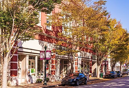 Shady trees lining the sidewalk in New Bern's Historic District. Image credit Wileydoc via Shutterstock.