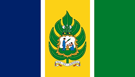 Blue, yellow, and green vertical bands separated by thin white stripes and the national emblem centered on yellow