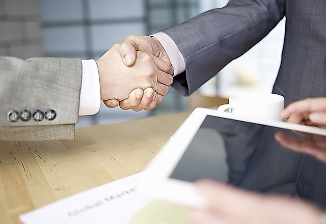 Two businessmen shaking hands