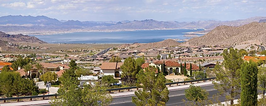 Boulder City Nevada suburbs and lake Mead with surrounding mountains panorama.