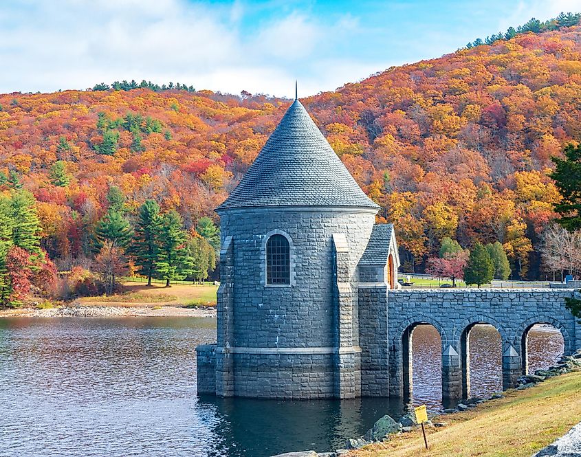 Saville Dam with colorful trees in the background, Barkhamsted, CT.