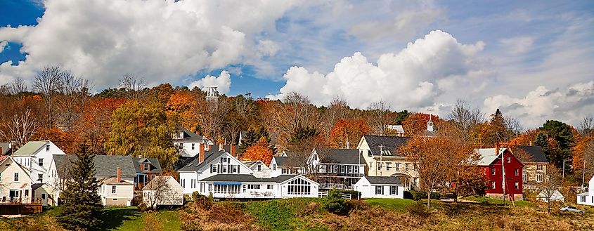 Waterfront homes surrounded by fall colors in Wiscasset, Maine