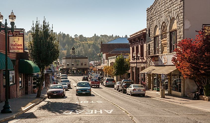 Lively street with historic brick buildings in Placerville, California.