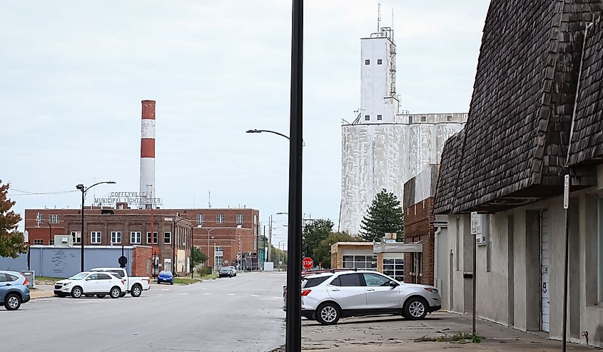 The townscape of Coffeyville, Kansas with buildings and cars