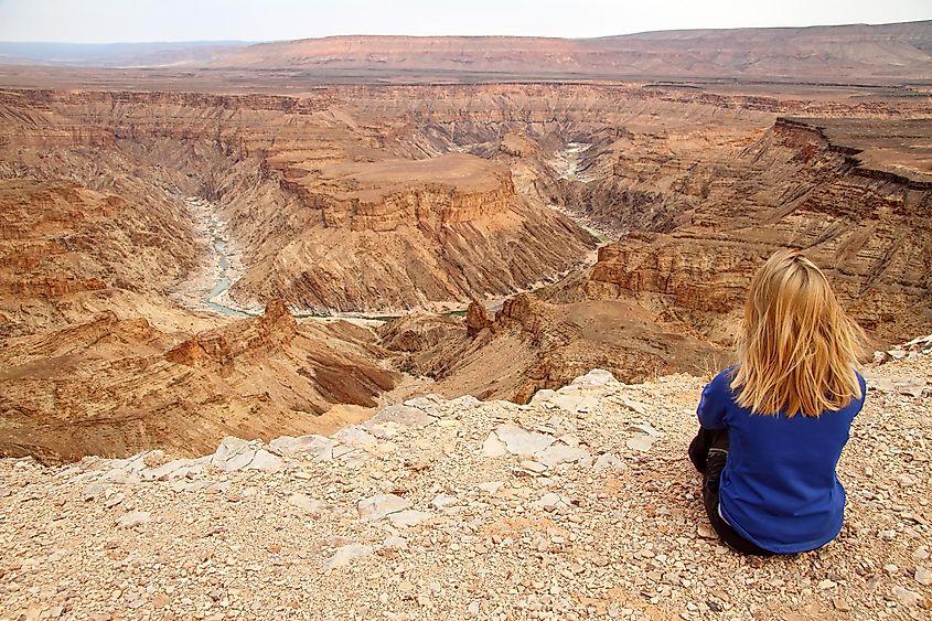 A visitor admiring the beauty of the Fish River Canyon.