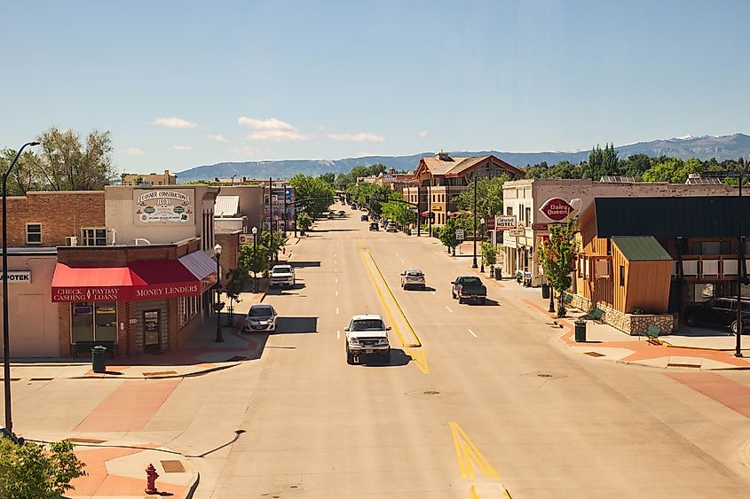 Overlooking the main street in Sheridan, Wyoming with cars driving.