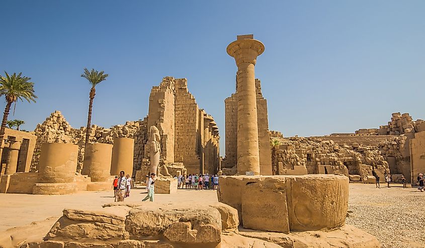 Ancient Temple of Karnak in Luxor - Ruined Thebes, Egypt. Walls and Sphinxes at Karnak Temple. Temple of Amon-Ra. Main entrance.