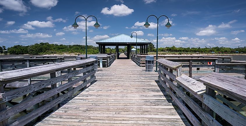 Symmetrical fishing pier with wooden surface texture, Mandeville, Louisiana.