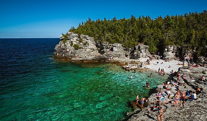 Tourists gather at Indian head cove The cove is located in Bruce Peninsula National Park on the shores of Georgian Bay.