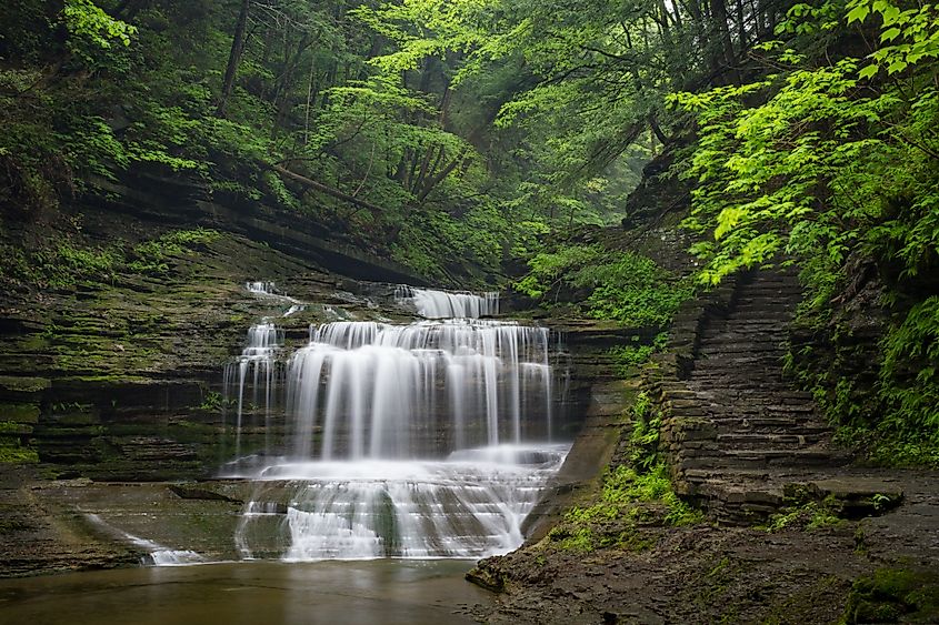 Waterfall cascades through Buttermilk Falls State Park, Ithaca, New York.