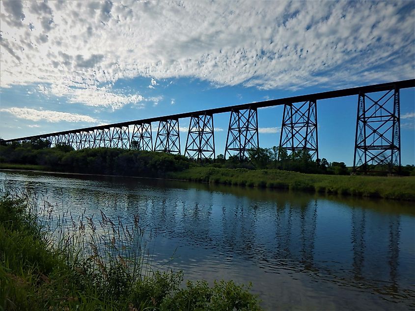 Hi-line bridge over the Sheyenne River reflected in the water, Valley City, North Dakota, USA.