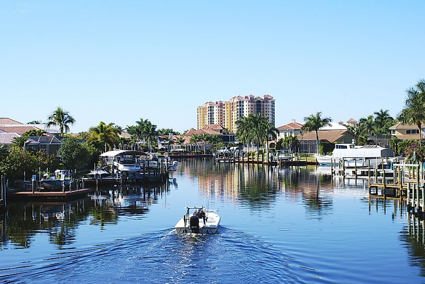 Boating along a canal in Cape Coral, Florida.