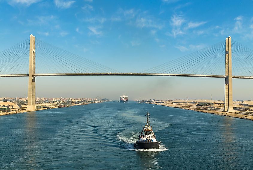 The Suez Canal Bridge crossing the Suez Canal with ships passing below.