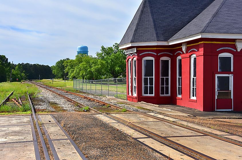 Trimmed with white, the red Haynesville Train Depot has been restored and stands besides the tracks in Haynesville, Louisiana.