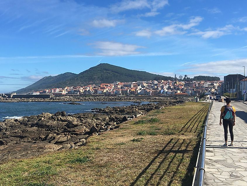 The Spanish seaside town of Guarda, with green hills in the background.
