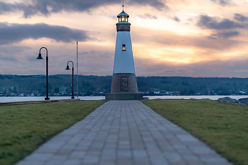 Myers Point Lighthouse at Myers Park in Lansing, Tompkins County, New York, at sunset. The lighthouse is situated on the shore of Cayuga Lake, near Ithaca.