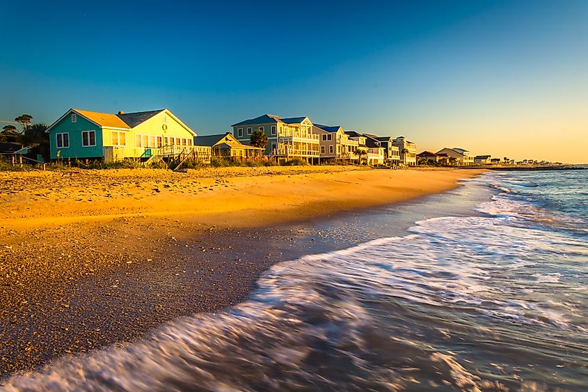 Edisto Beach, South Carolina: Morning light on beachfront homes with Atlantic Ocean waves.