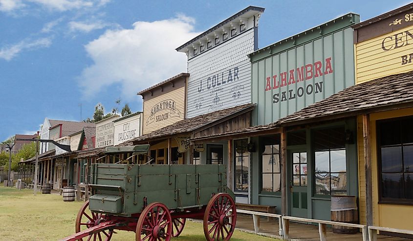 Façade of the Front Street replica with an old chuck wagon at the Boot Hill historical museum in Dodge City, Kansas.