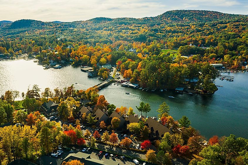Fall foliage by Lake George at sunset, captured by drone.