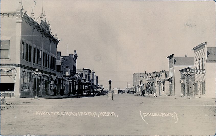  More details Late 1910s postcard view of Crawford Nebraska, looking north on Second Street from Linn.